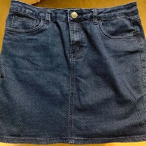 Dark blue denim skirt with white polka dots.